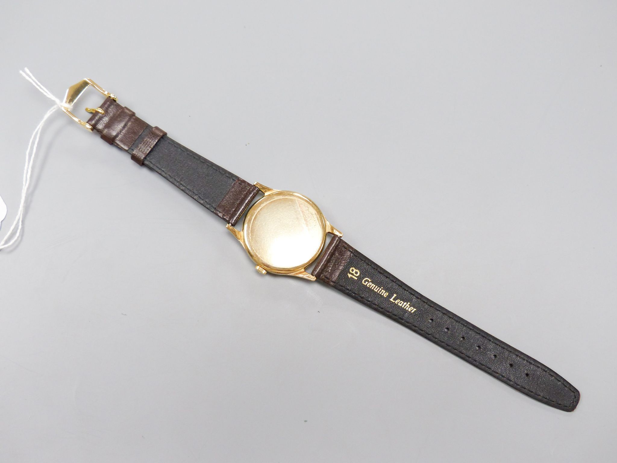 A gentleman's 1950's 9ct gold Omega manual wind wrist watch, movement c.266, on associated strap, cased diameter 33mm, gross weight 36 grams.